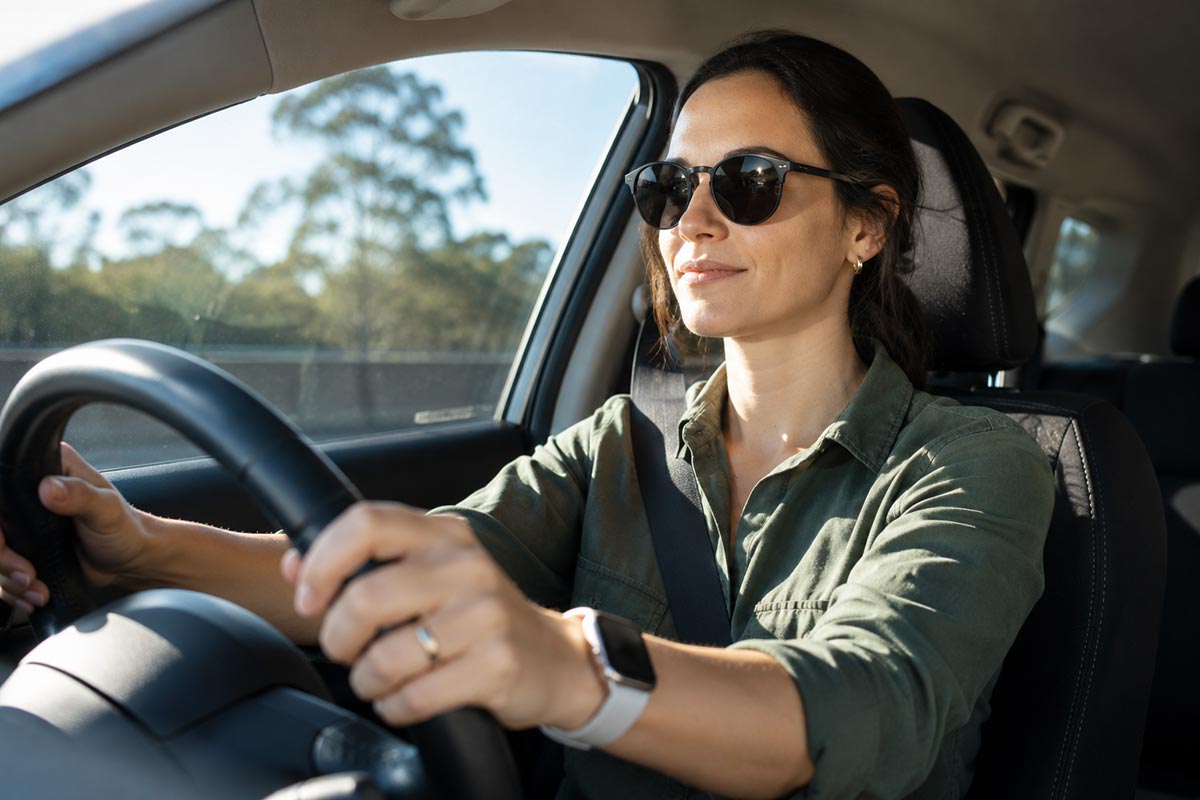 Woman driving wearing photochromic sunglasses